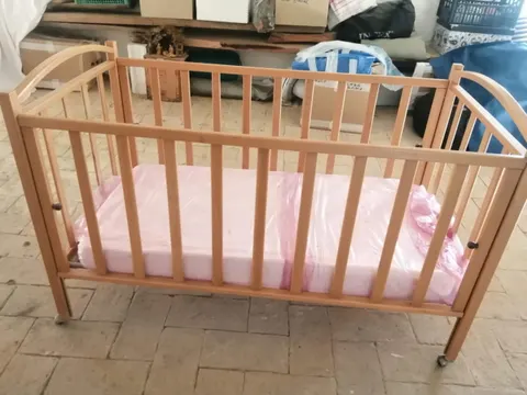 The wooden crib, available on request