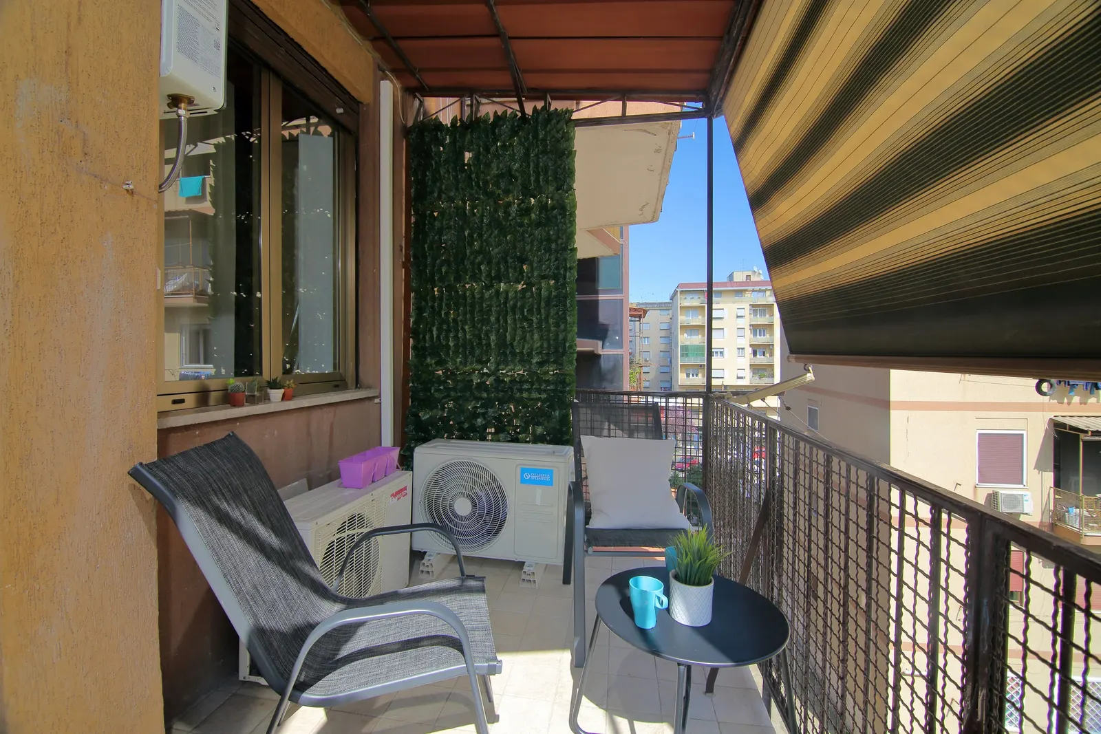The living-room balcony with chairs and a small table