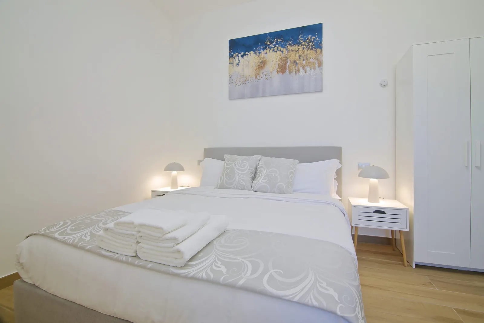Double bedroom with a white wardrobe