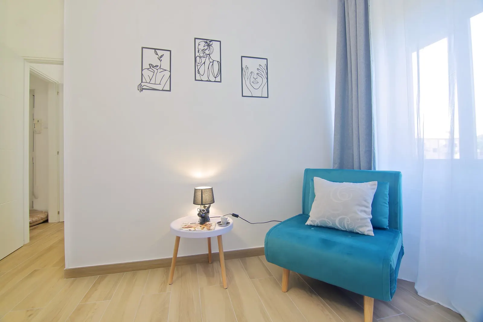 Reading corner with a blue armchair