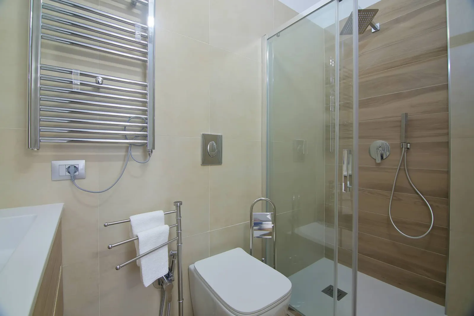 Glass shower and heated towel rail