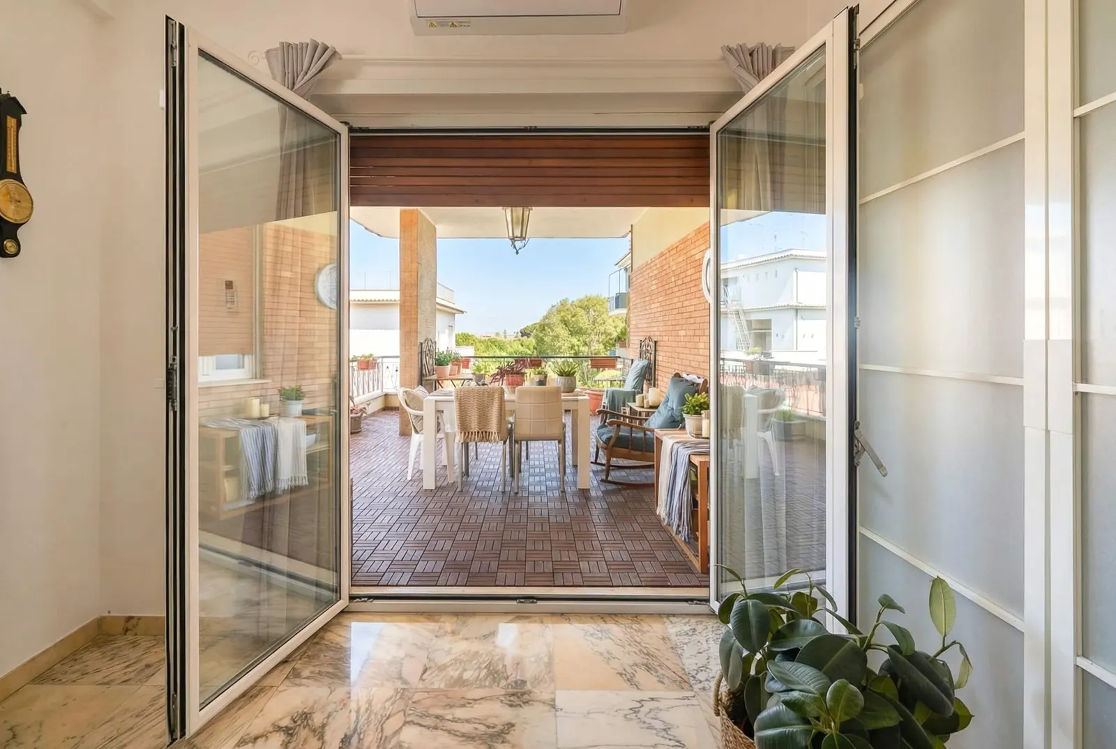 The suite's French window open onto the terrace
