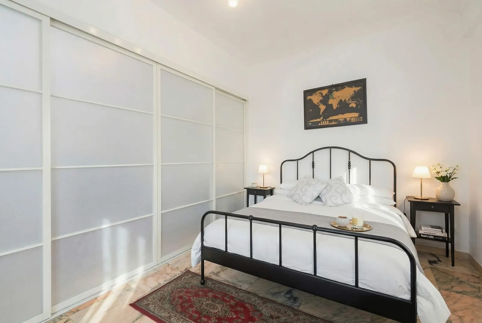 The suite: double bed and frosted-glass sliding partition