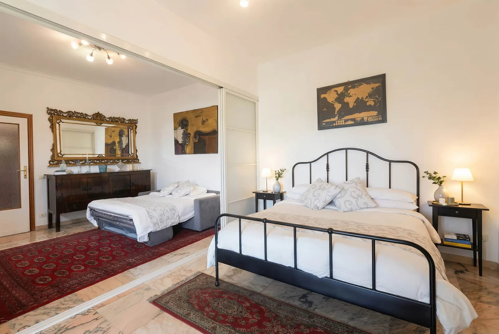 The suite with the double bed and the sofa bed made up