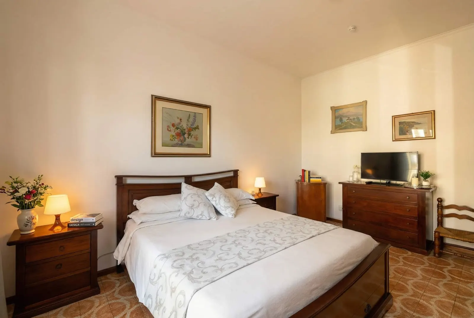 The romantic bedroom with chest of drawers and TV