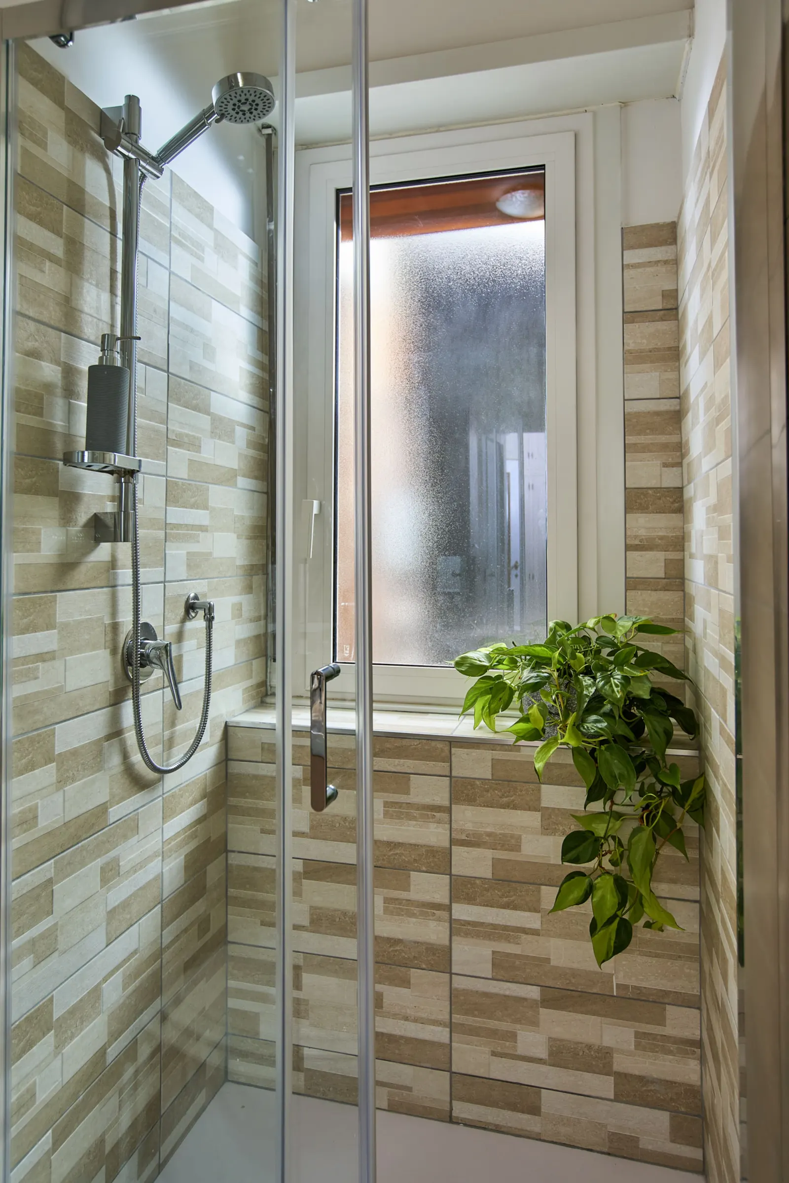 The glass shower in the private bathroom