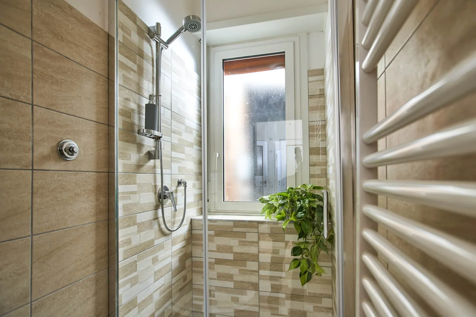 Shower and heated towel rail in the private bathroom