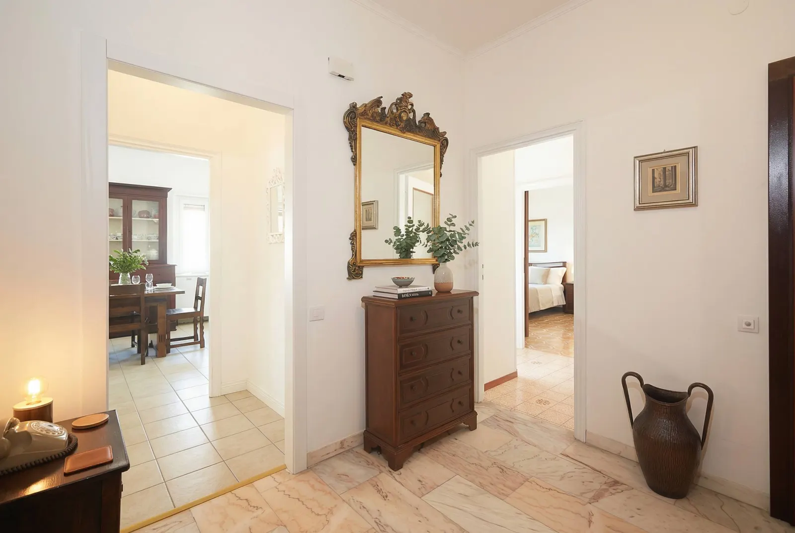 The hall with a sideboard and mirror